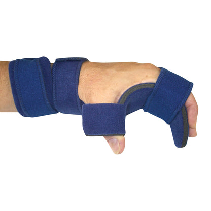 A person wears a Comfy Splints Adult Opposition Hand/Thumb Orthosis, a blue brace supporting the thumb and wrist on their left hand.