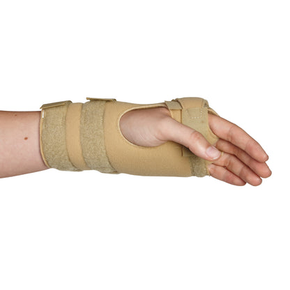 A person's hand and wrist are supported by an AliMed FREEDOM Arthritis Support brace with beige straps and a thumb hole.