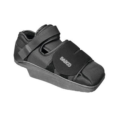 A DARCO HeelWedge Healing Shoe, featuring a black design with straps and a wedged sole for support.