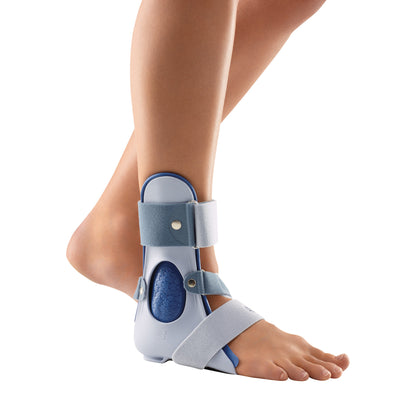 A leg wearing a Bauerfeind CaligaLoc Ankle Stabilizer, featuring straps and a supportive shell for stabilization.