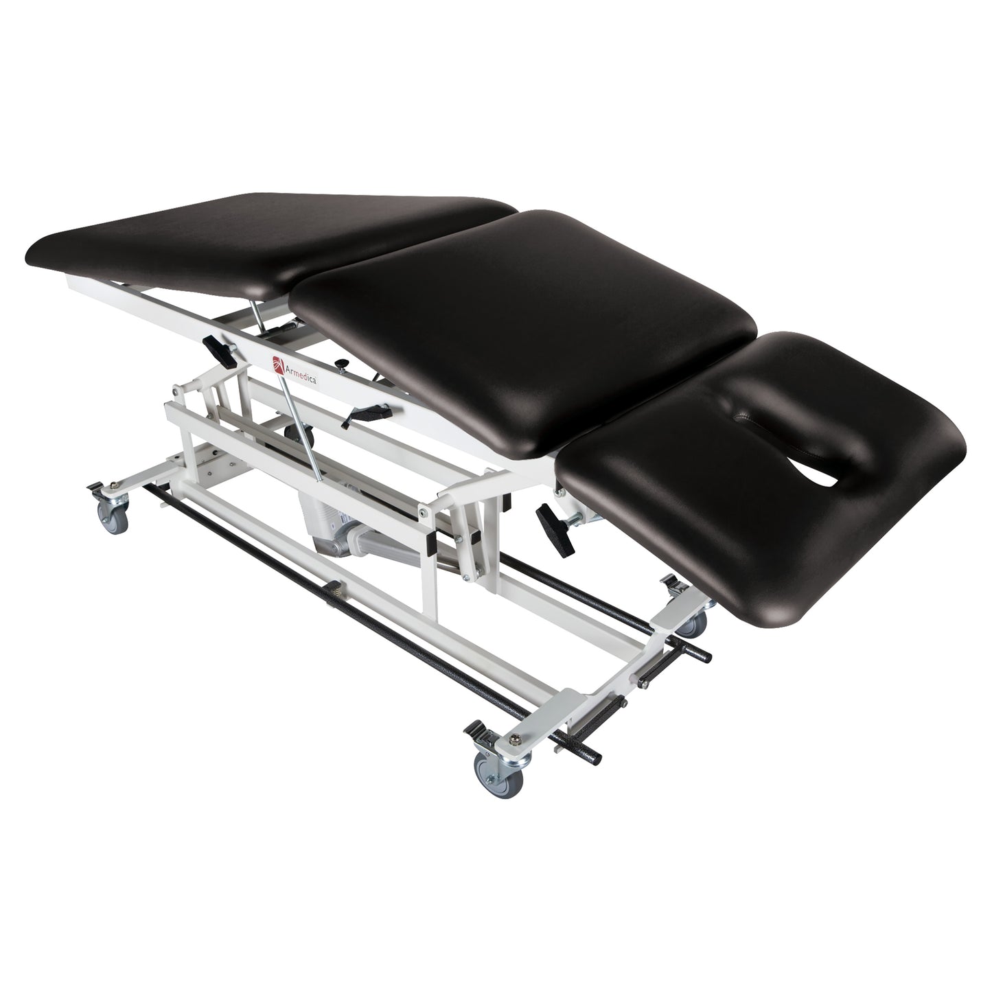 Armedica AM-BA300 Treatment Table with black cushioned sections, adjustable angles, face opening, and caster wheels.