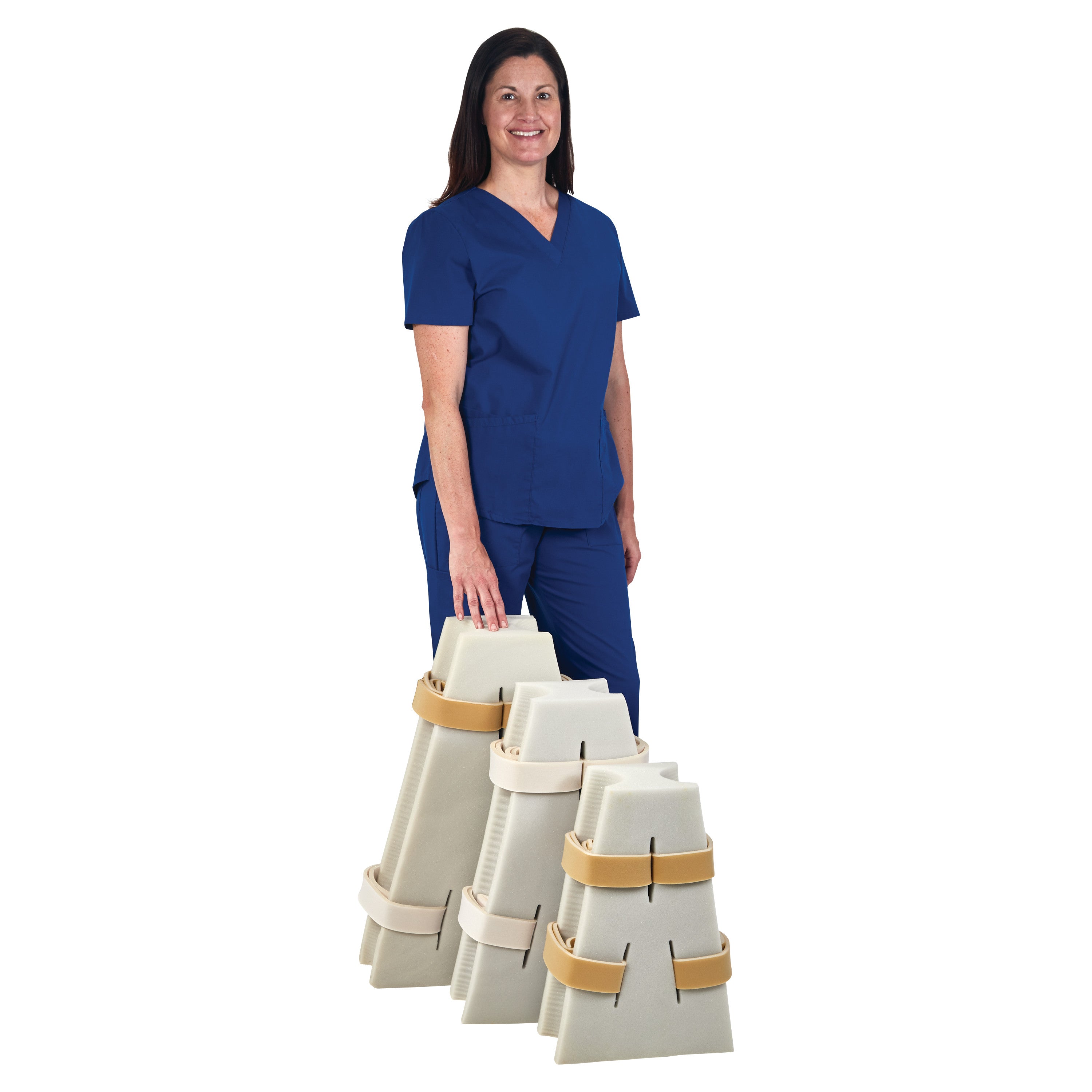 A person in blue scrubs holds multiple AliMed Abduction Pillows with straps, designed for medical leg support and alignment.