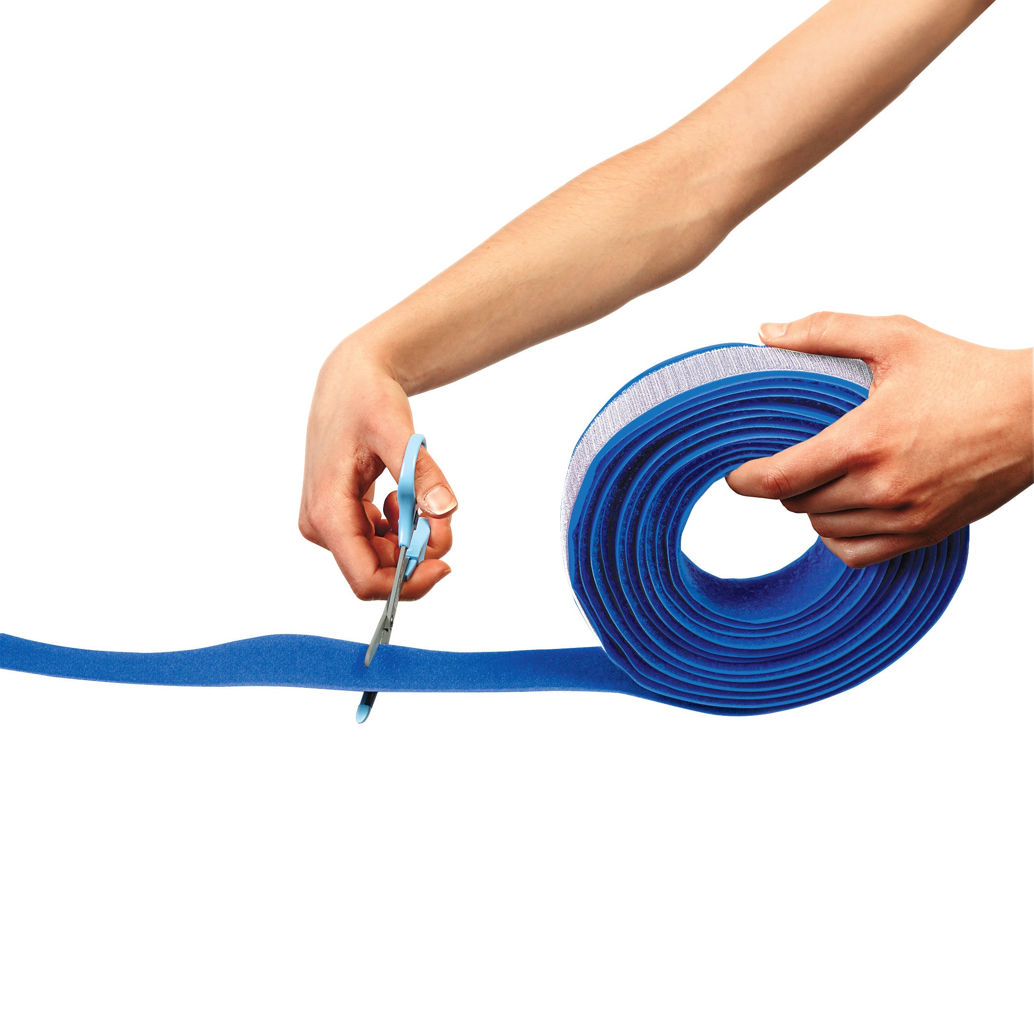Person cutting AliMed AliStrap Positioning Strap, a blue foam roll, with scissors on a white background.