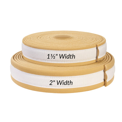 Two rolls of AliMed AliStrap Soft Positioning Strap, measuring 1.5" and 2" in width, made from beige material with white accents.
