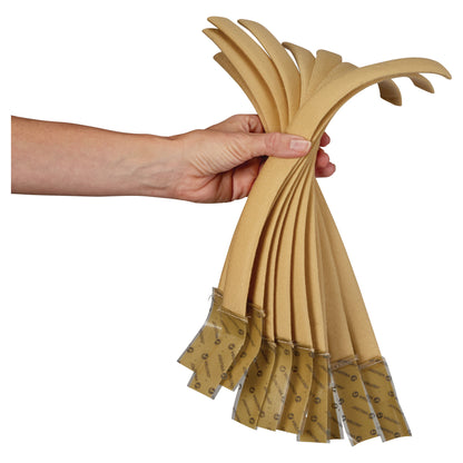 A hand holds several AliMed Beta Pile II Self-Adhesive Straps, showing their flexible beige material and adhesive ends.