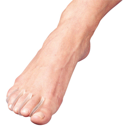 A foot wearing PediFix Visco-GEL Toe Separators, positioned between the first four toes to provide spacing and comfort.