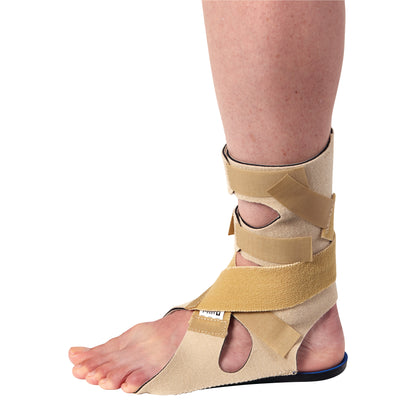 A leg wearing the AliMed FREEDOM Soft Footdrop Brace in beige, with multiple adjustable straps around the ankle and foot.