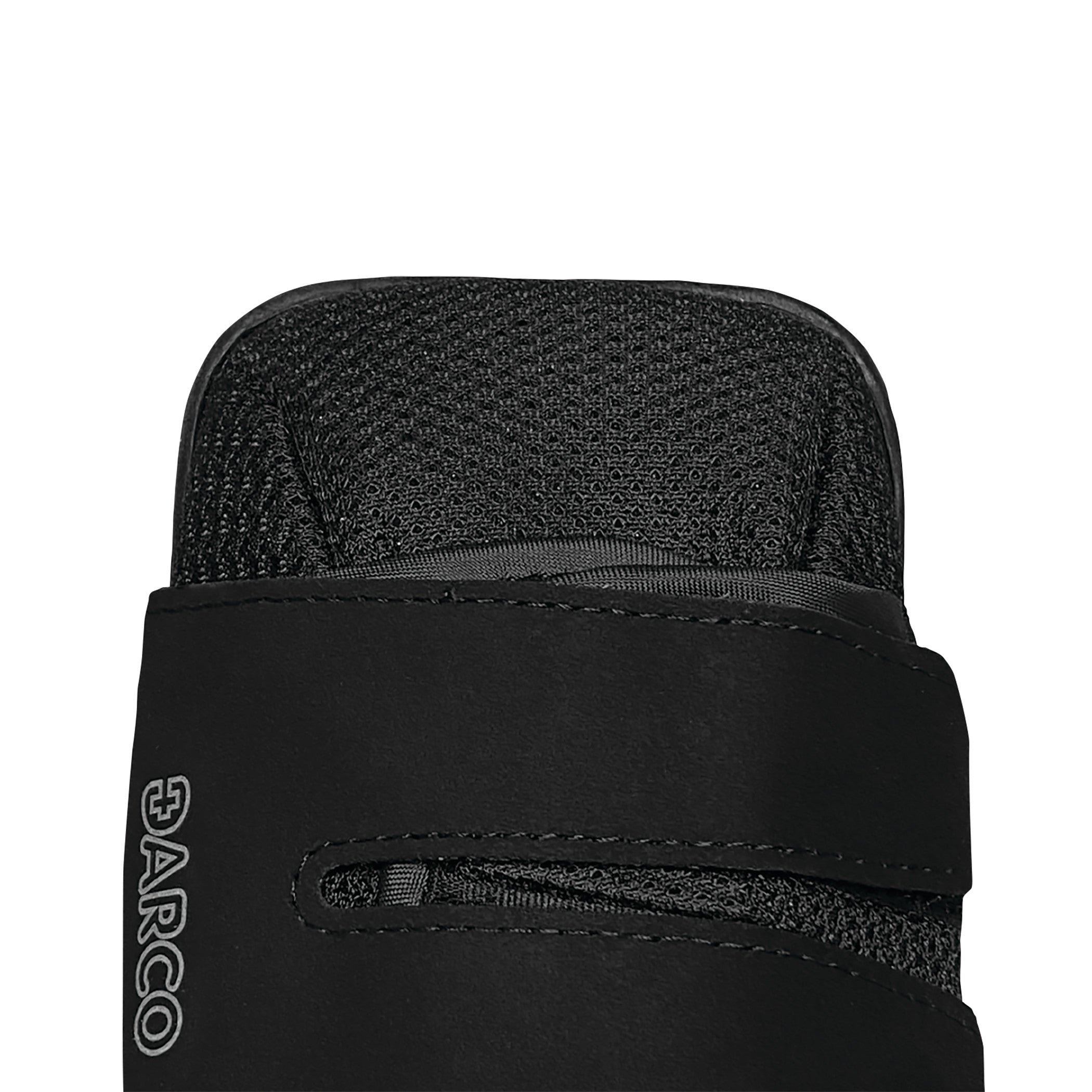 Close-up of the top of a black DARCO HeelWedge Healing Shoe, featuring a textured fabric and a strap with the brand logo visible.