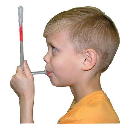 A child uses a TheraSIP TonguePRESS, a tool for oral therapy, holding it in one hand and pressing it with their tongue.