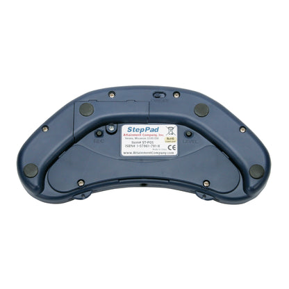 The back view of a StepPad Communication Device, featuring button labels, a sticker with details, and black rubber pads.