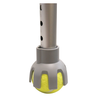 A Therafin Walker Tennis Ball Glide attached to a metal walker leg. It features a gray plastic holder with a yellow tennis b.