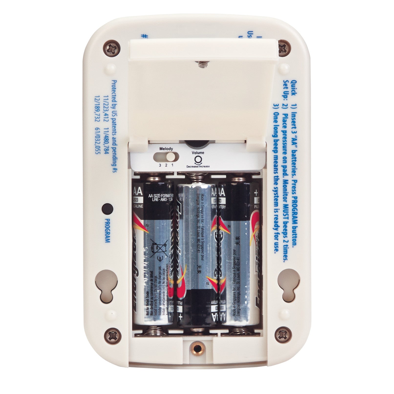 The back of an AliMed IQ CordLess Sensor Alarm with its battery compartment open, revealing four AA batteries.