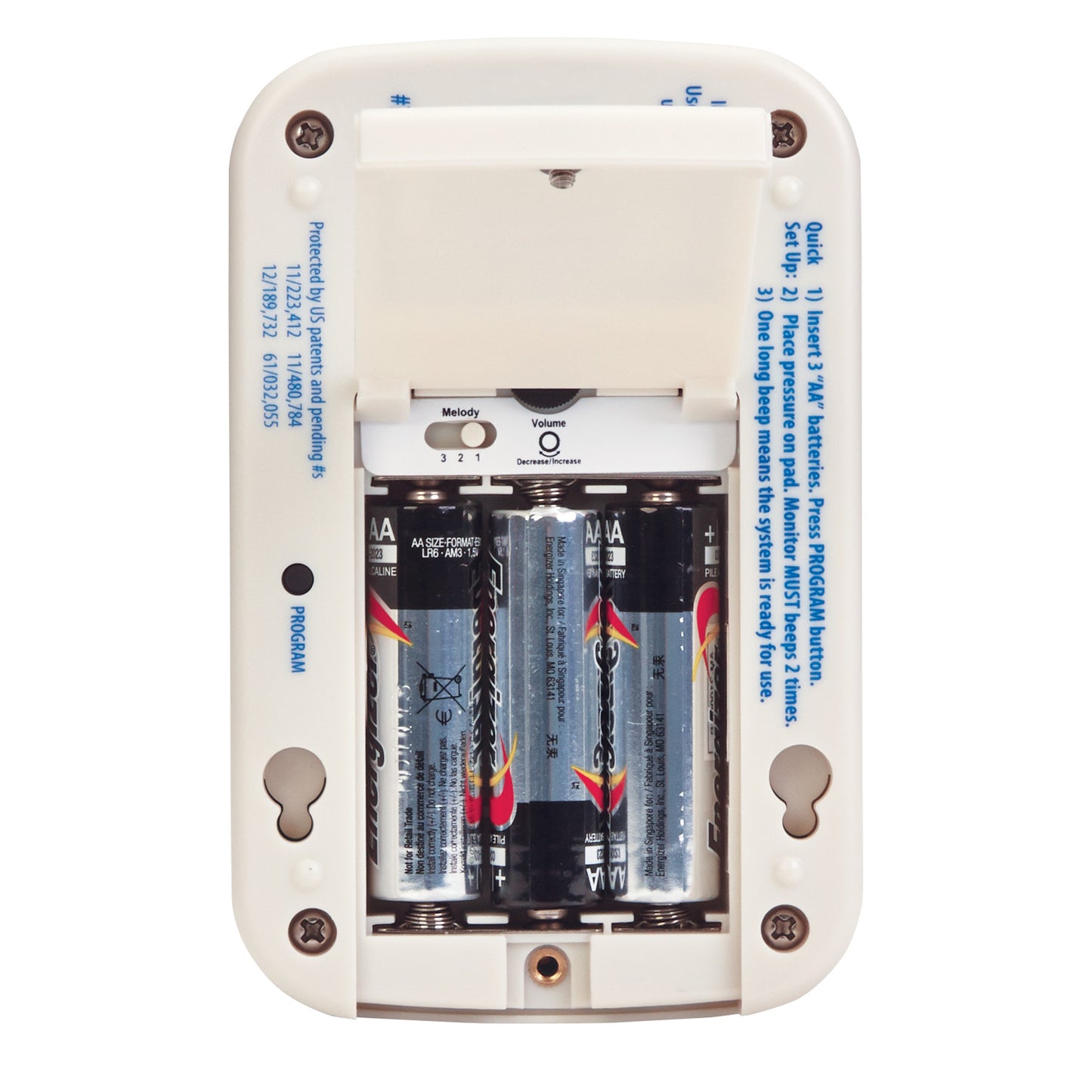 The back of an AliMed IQ CordLess Sensor Alarm with its battery compartment open, revealing four AA batteries.