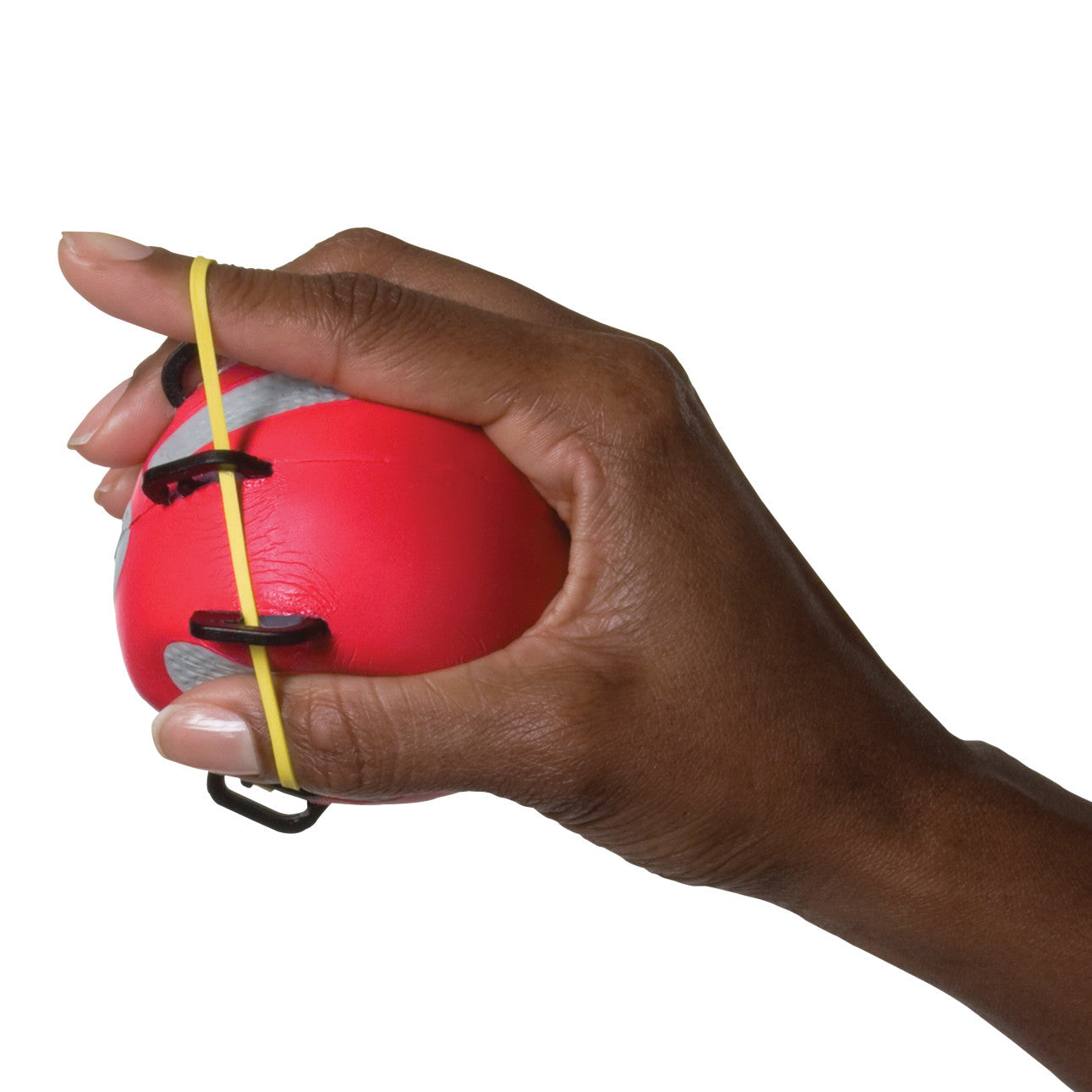 A hand holds a red CanDo Digi-Extend n' Squeeze Hand Exerciser with elastic loops around the fingers.