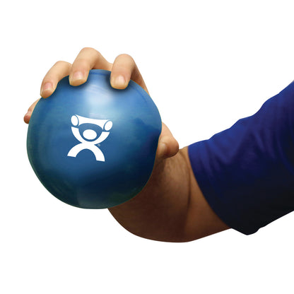A person grasps a blue "CanDo Hand WaTE Ball" featuring a white logo. The ball is held in a hand against a white background.