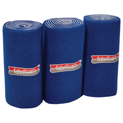 Three blue FabriFoam NuStim Wrap rolls, each with a logo, are standing upright against a white background.