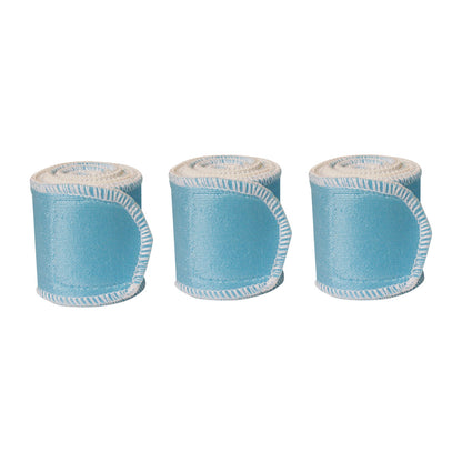 Three rolled Chattanooga Nylatex Wraps in light blue with white edges are aligned in a row.