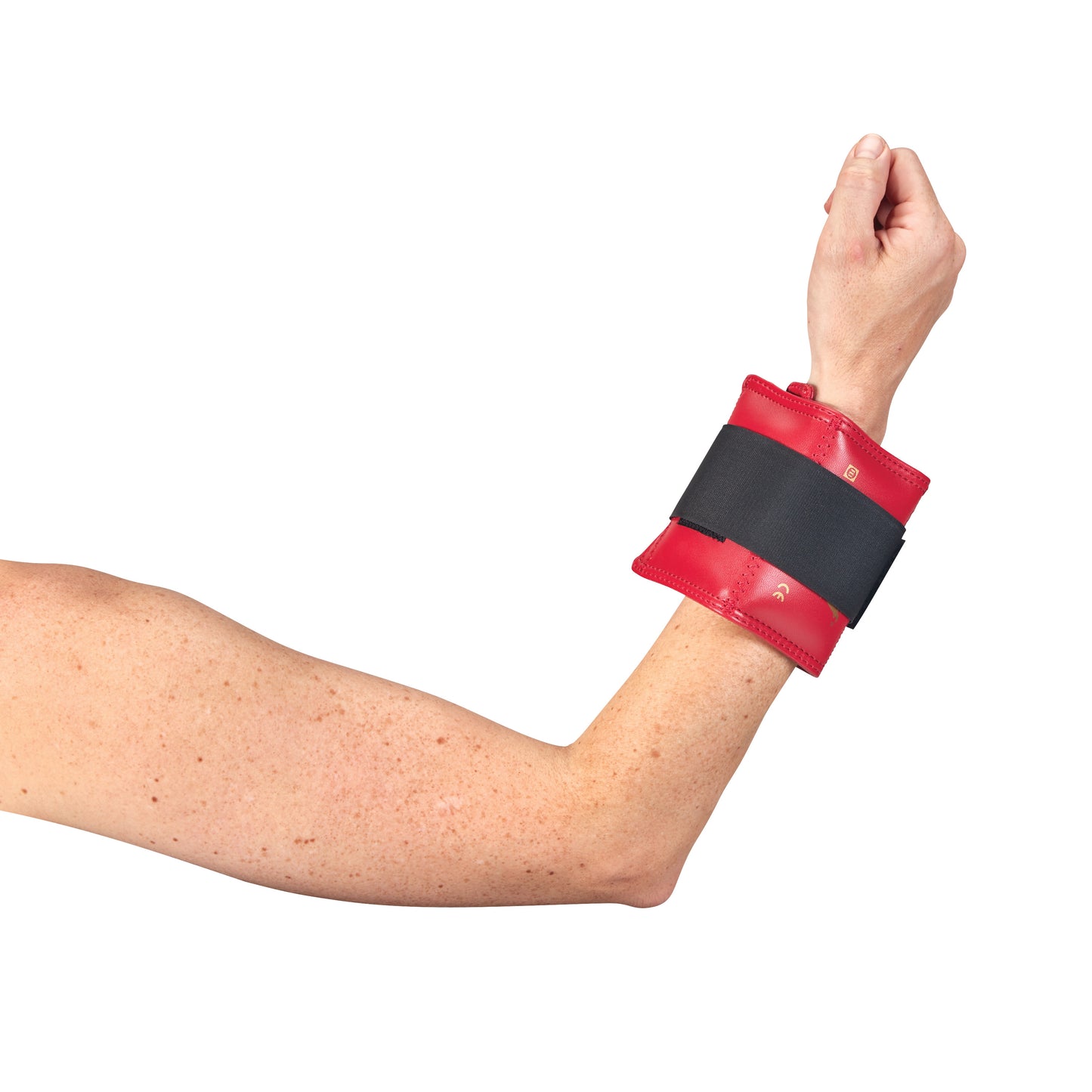 An arm wearing an AliMed Color-Coded Cuff Weight, red with a black strap, around the wrist.