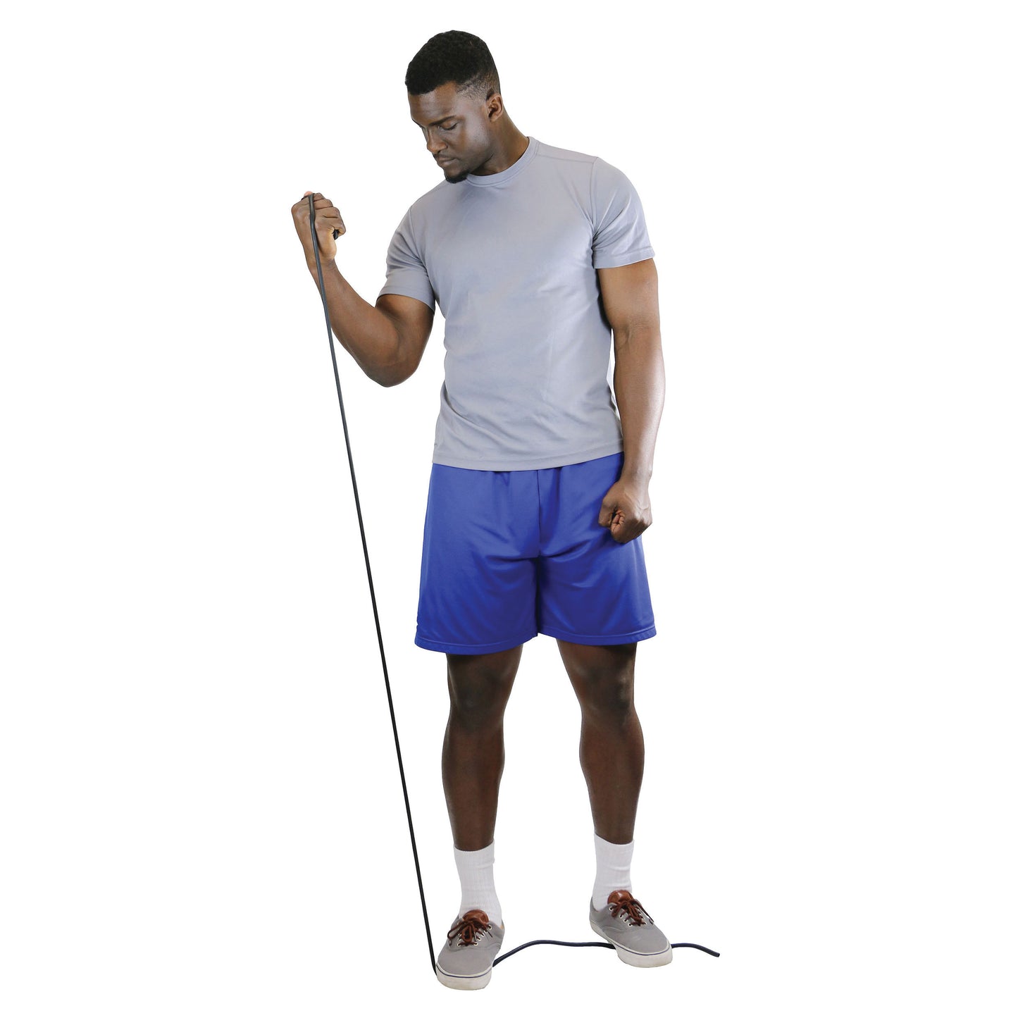 A man in gray and blue athletic wear is using CanDo Exercise Tubing, pulling it up while standing on the other end.