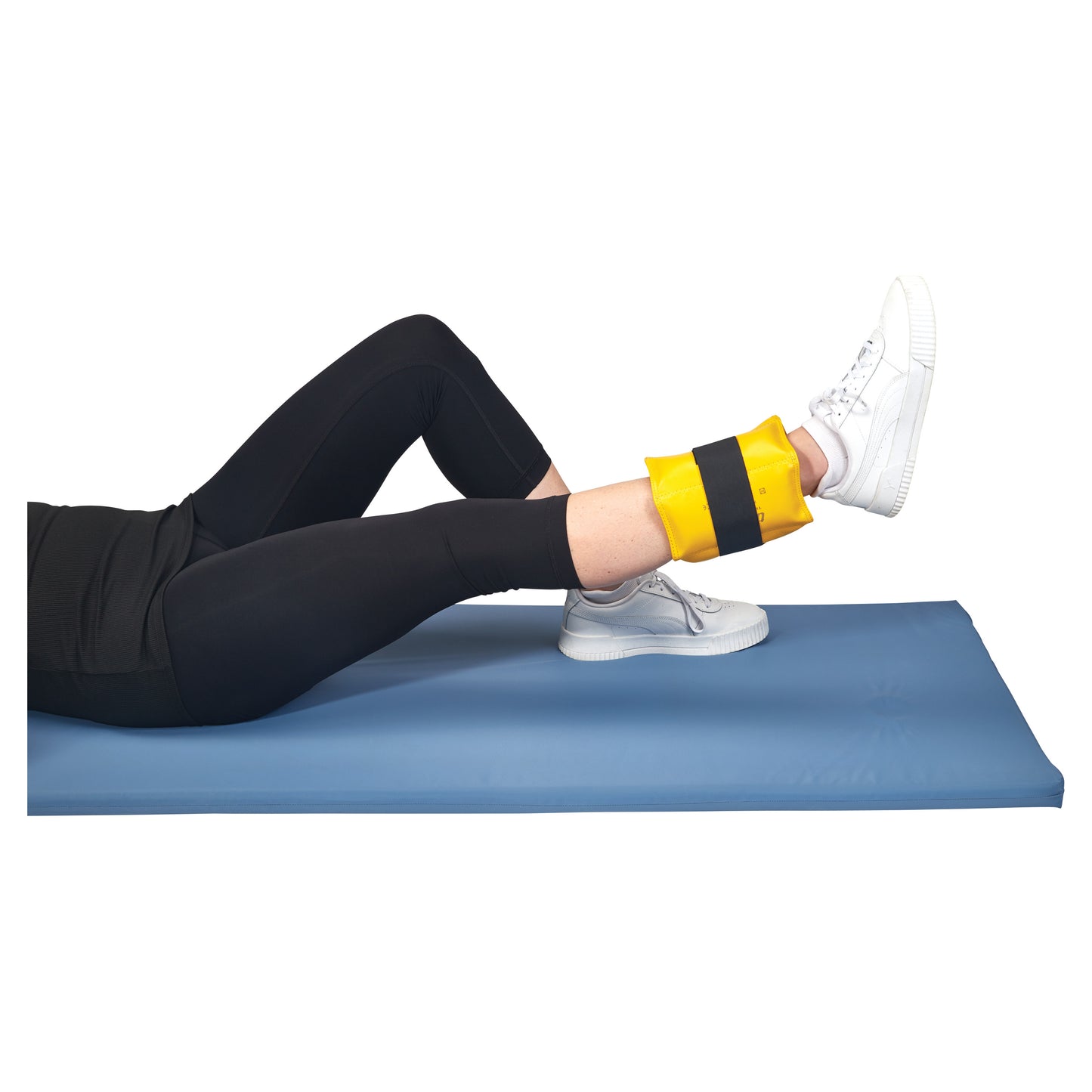 Person exercising on a blue mat wearing an AliMed Color-Coded Cuff Weight in yellow on the ankle.