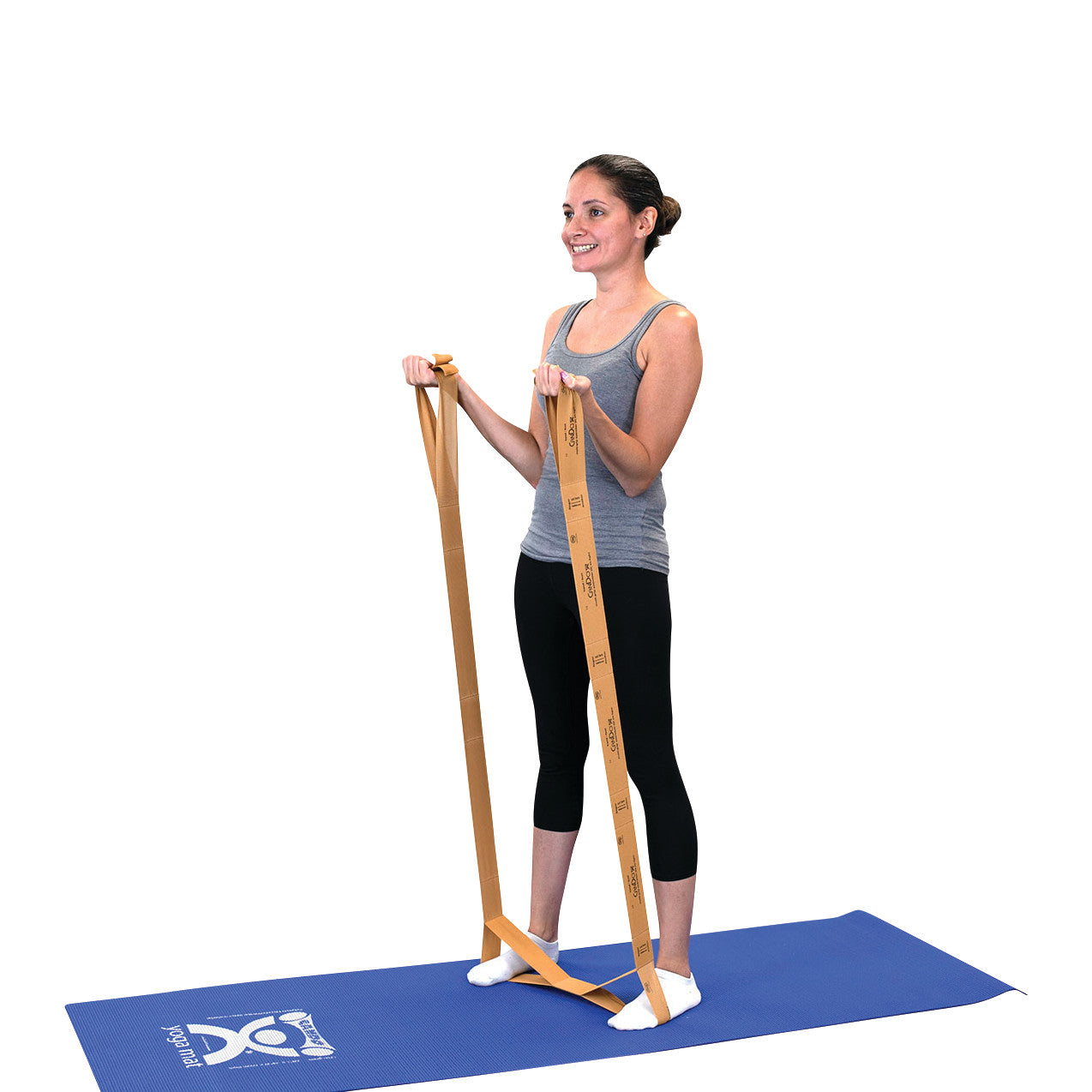 A woman exercises with a CanDo Multi-Grip Exerciser, standing on a blue mat while stretching the bands in both hands.