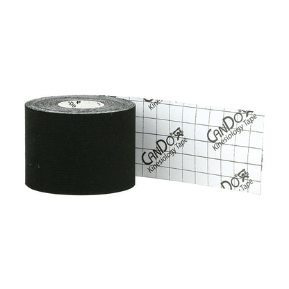 A roll of CanDo Kinesiology Tape, black with a white backing showing a grid and logo, partially unrolled.