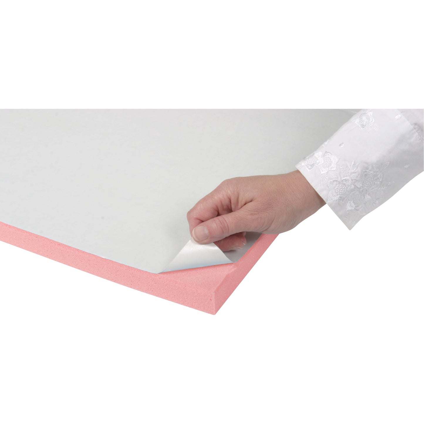 A hand peels a white cover to reveal the adhesive side of a pink AliMed T-Stick Adhesive-Backed Padding.