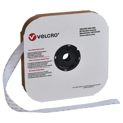 VELCRO Brand Adhesive-Backed Loop roll with white tape on a cardboard dispenser, featuring logo and company details.