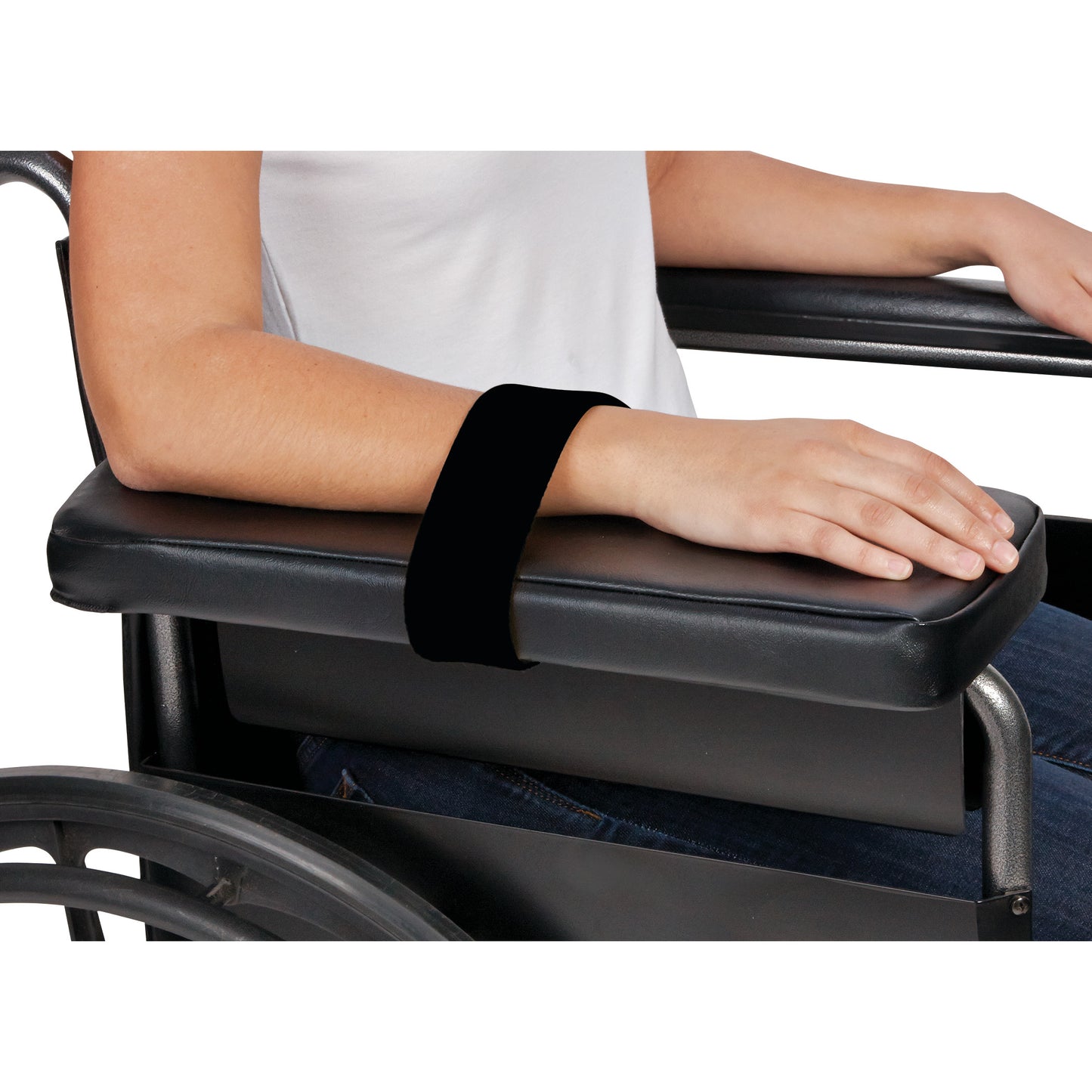 A person uses an AliMed Beta Pile II Loop to secure their arm to a wheelchair's black armrest.