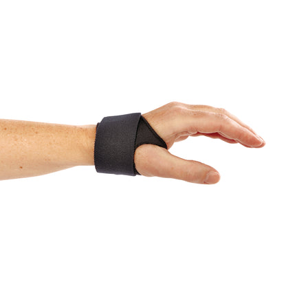 A hand wearing the AliMed FREEDOM AliDry CMC ThumbFit Support, a black thumb brace designed for support and comfort.