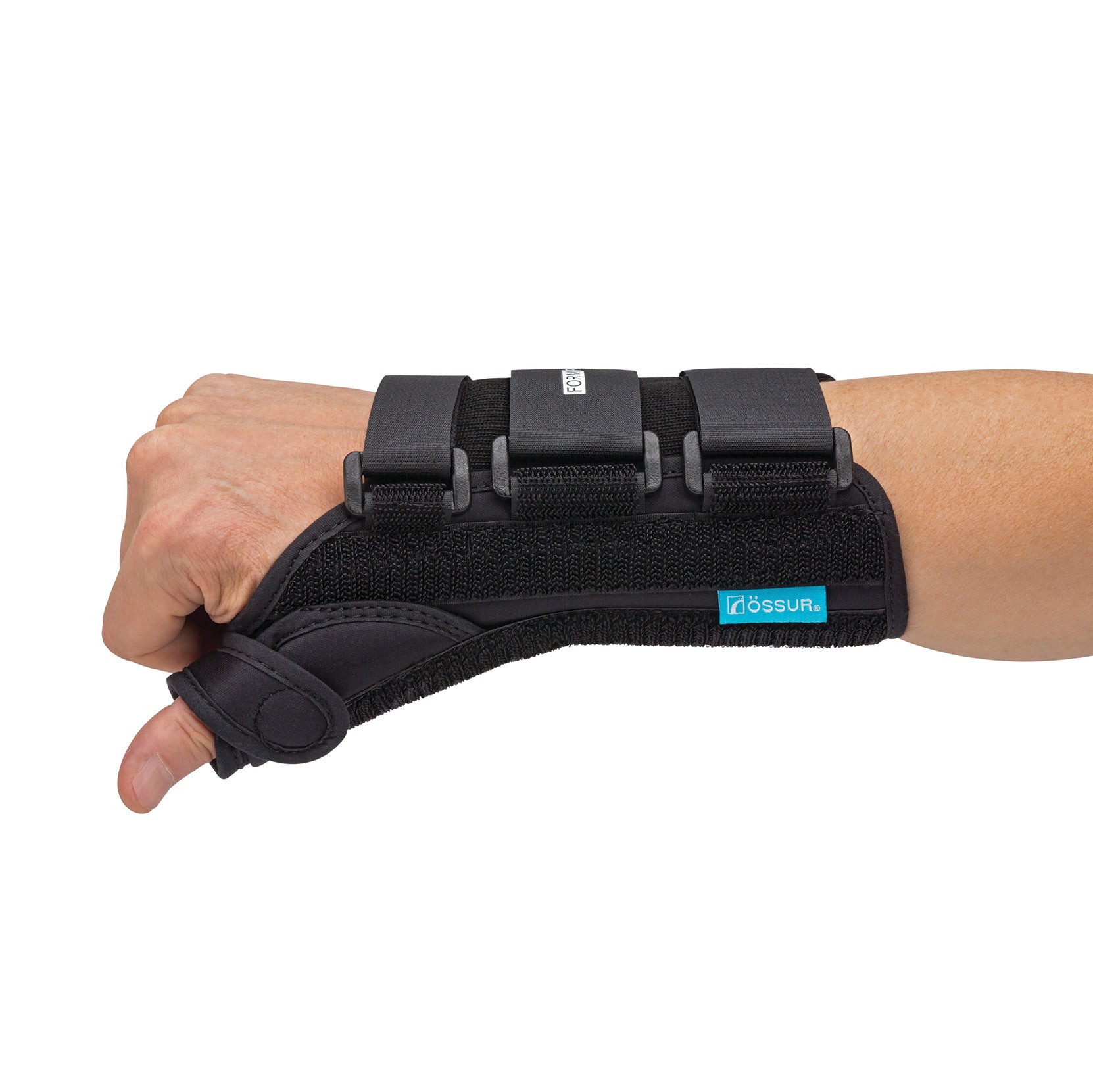 A hand wearing an �ssur Formfit Thumb Spica Splint, secured with straps, providing support to the wrist and thumb.
