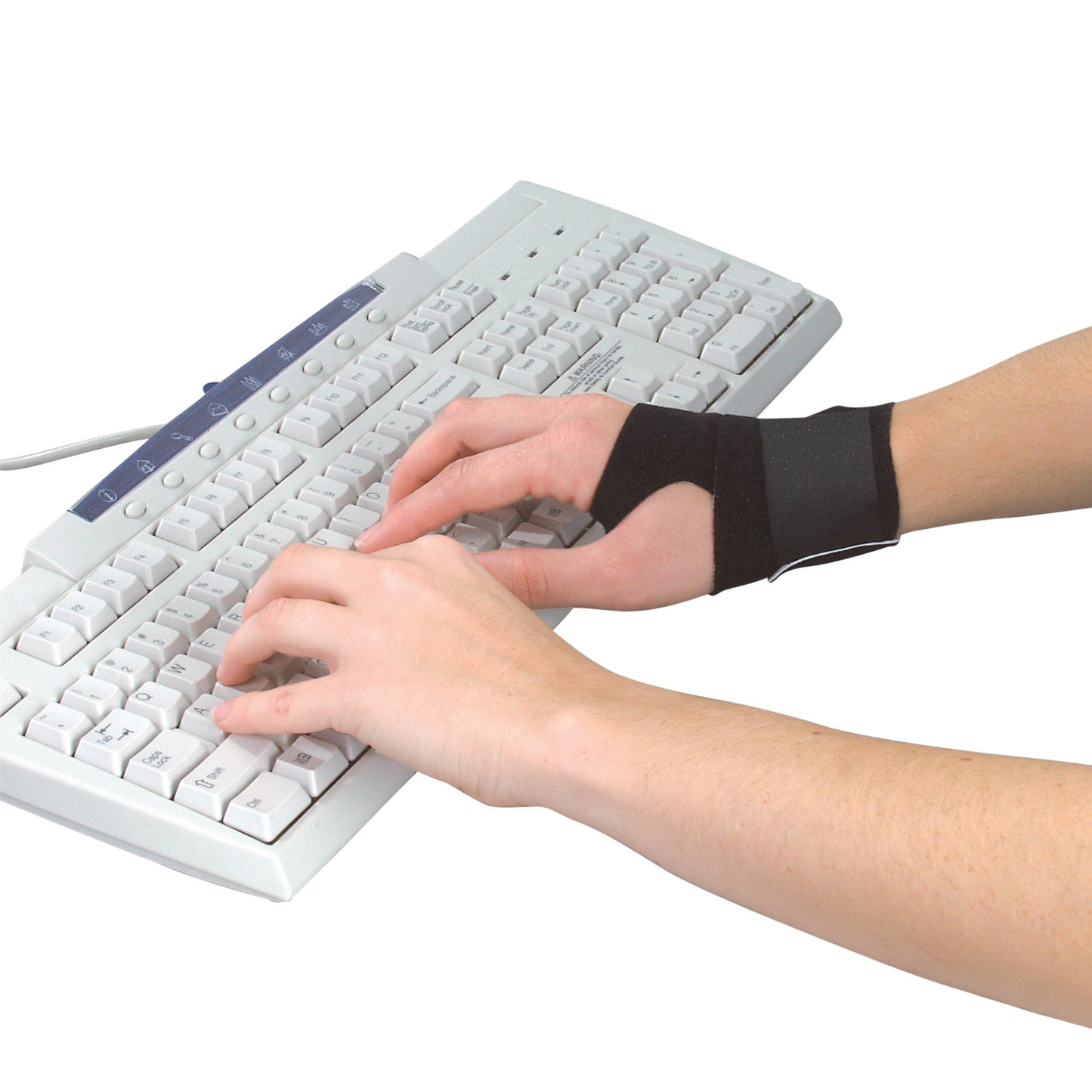 Hands are typing on a keyboard while wearing an AliMed FREEDOM comfort fabrifoam Wrist Wrap on the right wrist.
