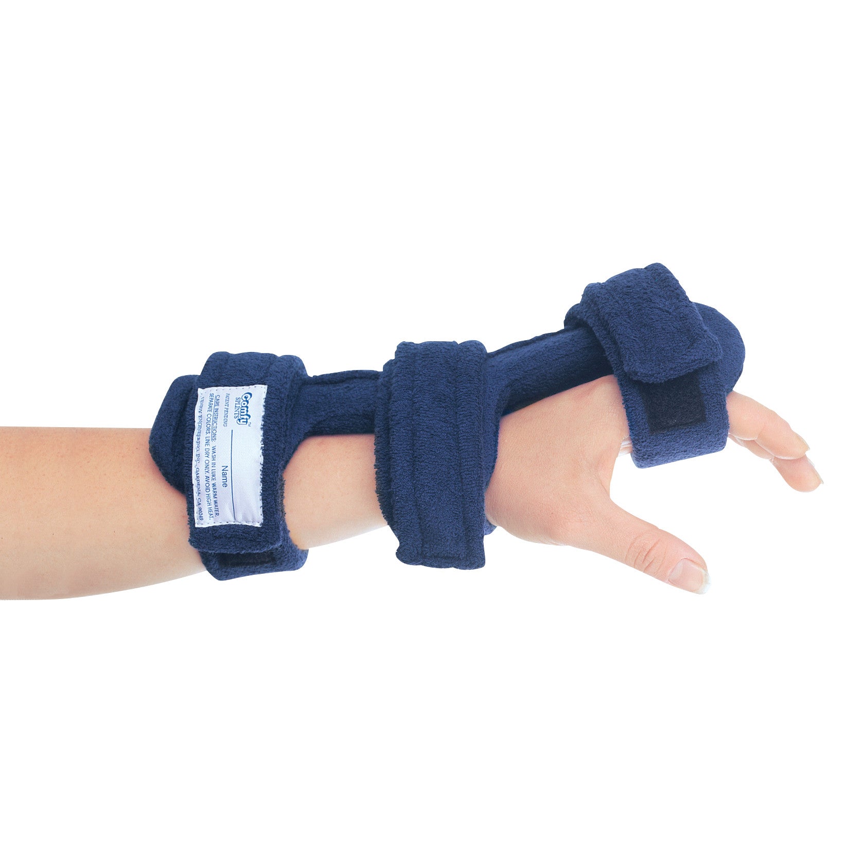 A hand wearing the Comfy Splints Adult Dorsal Hand Orthosis, featuring navy blue fabric and multiple adjustable straps.