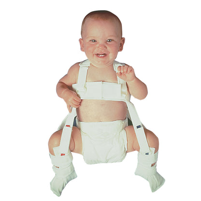 A smiling baby wears a Wheaton Pavlik Harness, designed for hip stabilization. It includes shoulder straps and leg supports.
