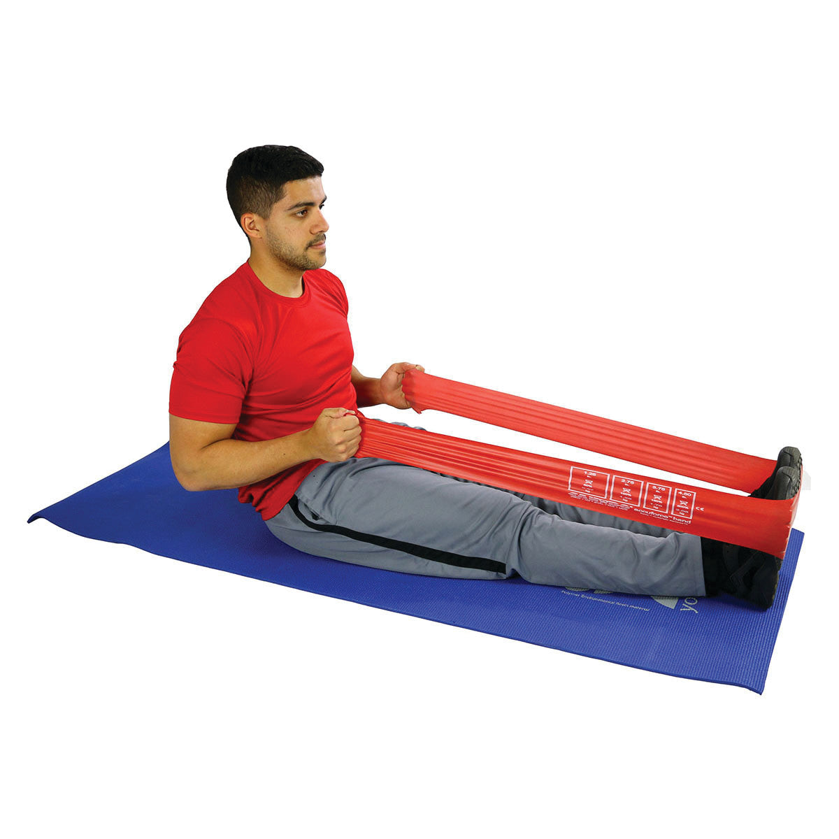A person exercises with a CanDo AccuForce Latex Exercise Band, seated on a blue mat, stretching the red band over their feet.
