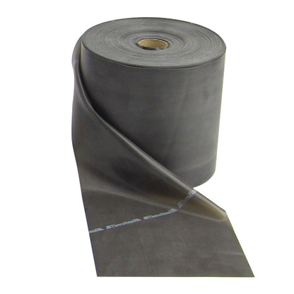 A roll of THERABAND Non-Latex Resistive Exercise Band, unrolled partially, showing its smooth, gray surface.