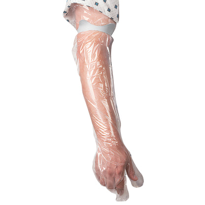 A person's arm is covered with a Brownmed SEAL-TIGHT Seal Band, a clear protective sleeve extending from hand to above the elbow.