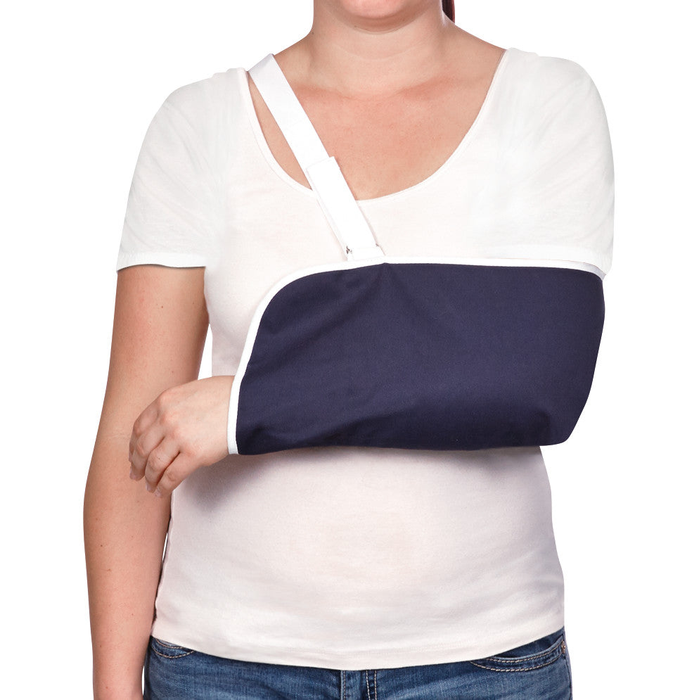 The AliMed Envelope Style Arm Sling is shown on a person. It is navy with white trim and features an adjustable shoulder strap.
