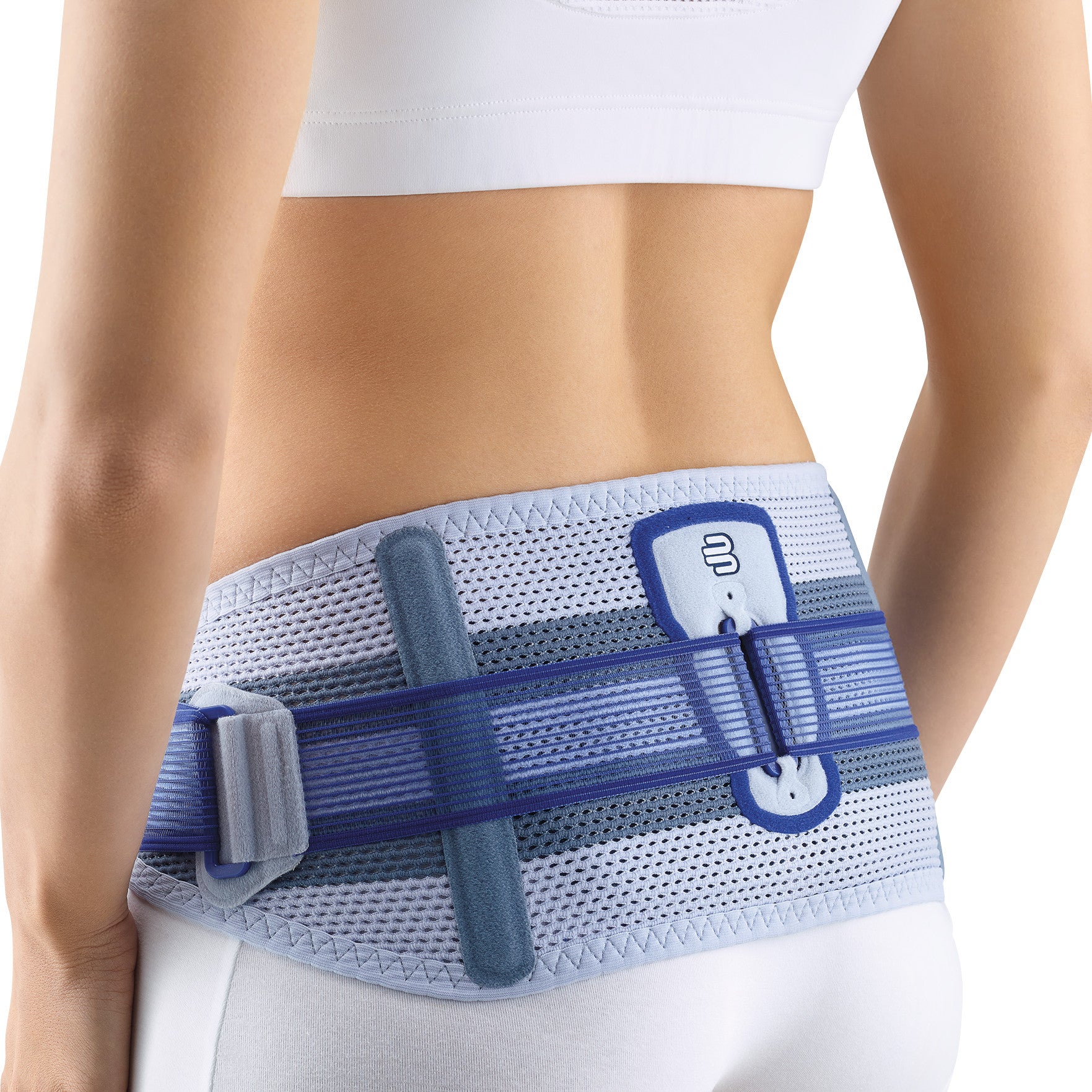 A person wears a Bauerfeind SacroLoc support belt around the lower back and hips, showcasing its design and adjustable straps.