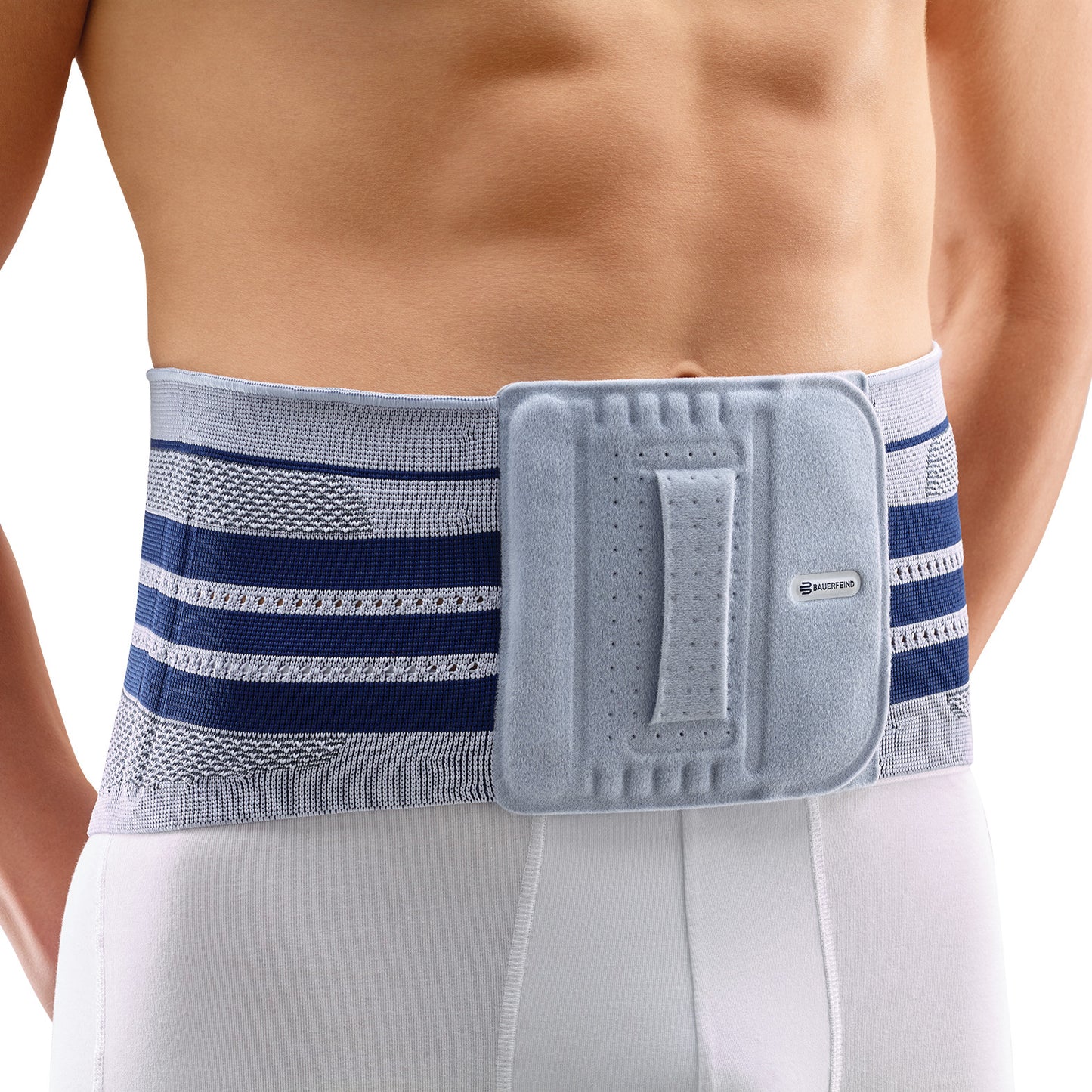 A person wearing a Bauerfeind LumboTrain Back Support around their lower back, featuring a blue and gray pattern with a central fastening.