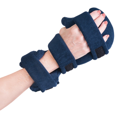 A hand wearing the Comfy Splints Adult Deviation Opposition Hand/Thumb Orthosis, featuring navy straps for support and alignment.
