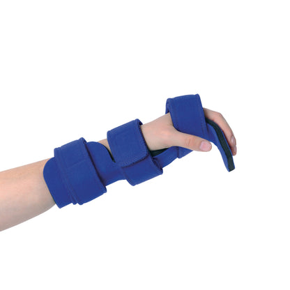 A child's hand wears the Comfy Splints Pediatric Deviation Hand/Wrist Orthosis with blue straps for support and alignment.