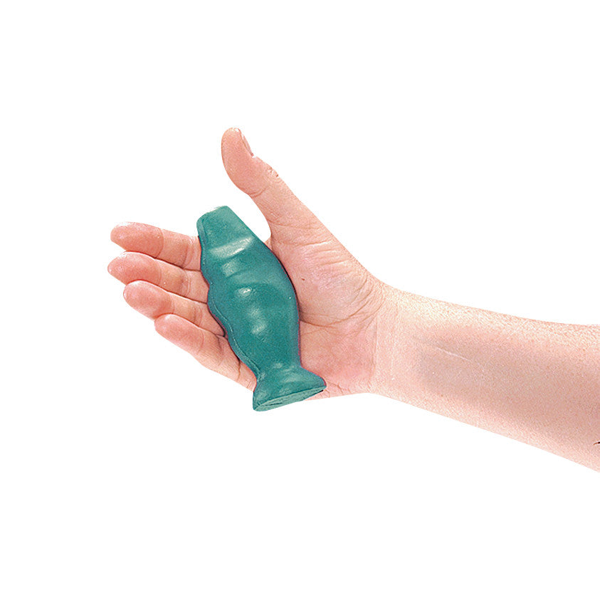 A hand holds the green AliMed Swanson Grip-X Hand Exerciser, shaped like a fish, for strengthening grip and flexibility.