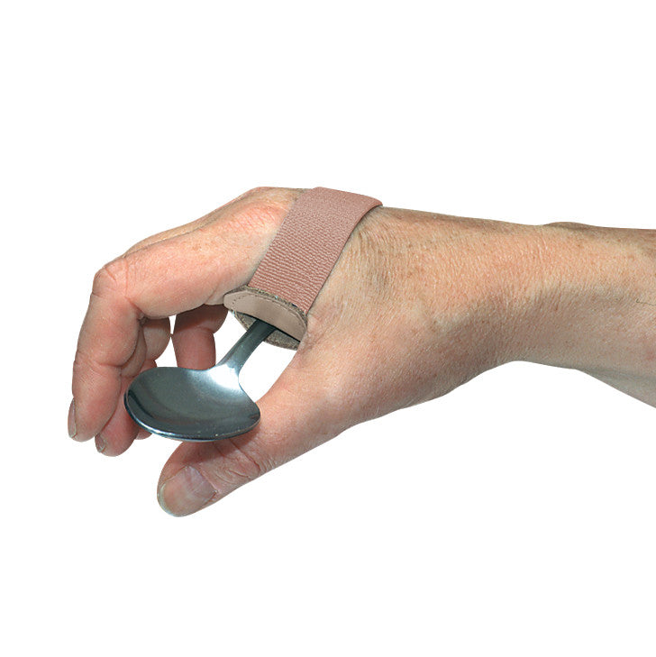 A hand holds a spoon with a Universal Elastic ADL Cuff. The cuff is beige and wraps around the hand, securing the utensil.