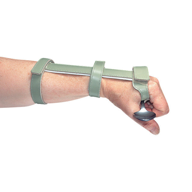 A person's hand wearing an Economy ADL Wrist Support, featuring olive straps and holding a spoon handle.