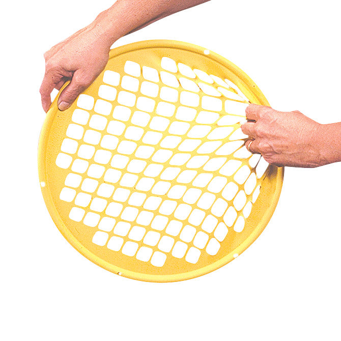 Two hands hold a yellow Power-Web Exerciser, a circular mesh tool for hand strengthening and rehabilitation.