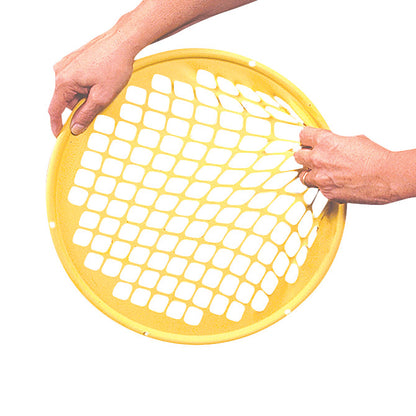 Two hands hold a yellow Power-Web Exerciser, a circular mesh tool for hand strengthening and rehabilitation.