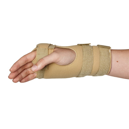 A hand wearing an AliMed FREEDOM Arthritis Support wrist brace in beige, designed for wrist and hand support.
