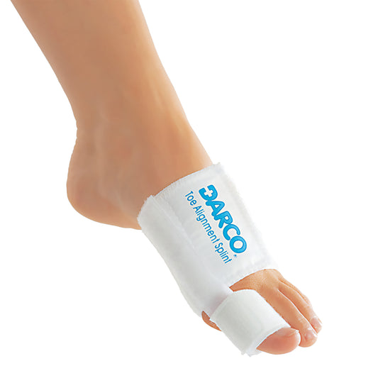 A foot wearing a DARCO Toe Alignment Splint, designed to correct toe positioning, with white straps securing the big toe.