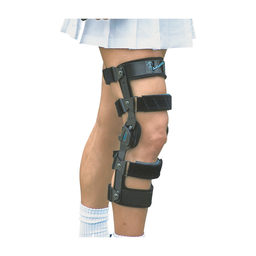 A person wears an ExoTec Dual Instabilities Lite Knee Brace, featuring adjustable straps and hinges on the knee and thigh area.